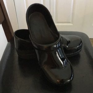 Dansko patent leather clogs
